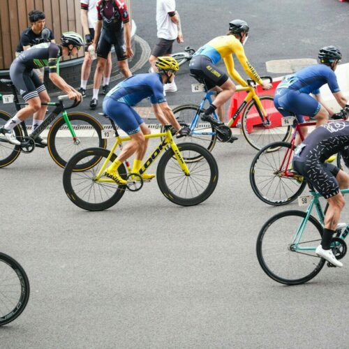 people riding on bicycle cycling at daytime