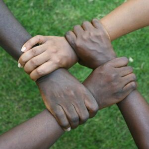 a group of hands holding each other